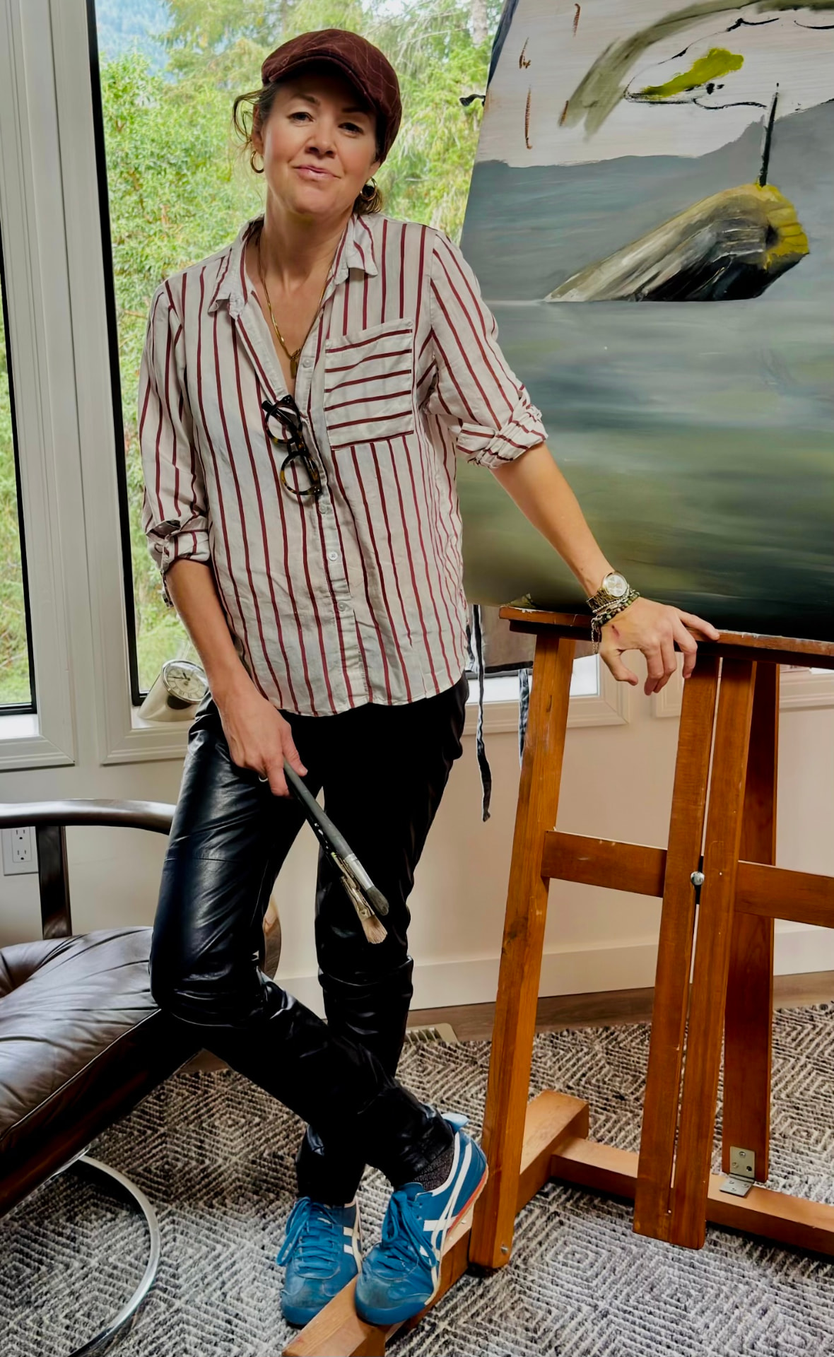 Catherine M. Wedderspoon in her studio beside her easel